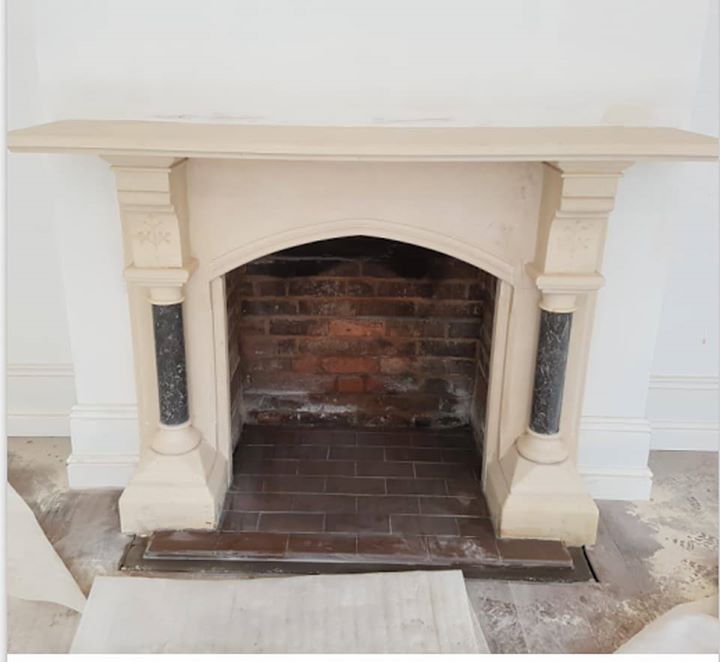 A traditional stone fireplace having some repointing and a hearth fitted for an open fire. North Wales, North West, Wirral, Liverpool & Cheshire UK